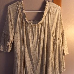 Off the shoulder beige top.